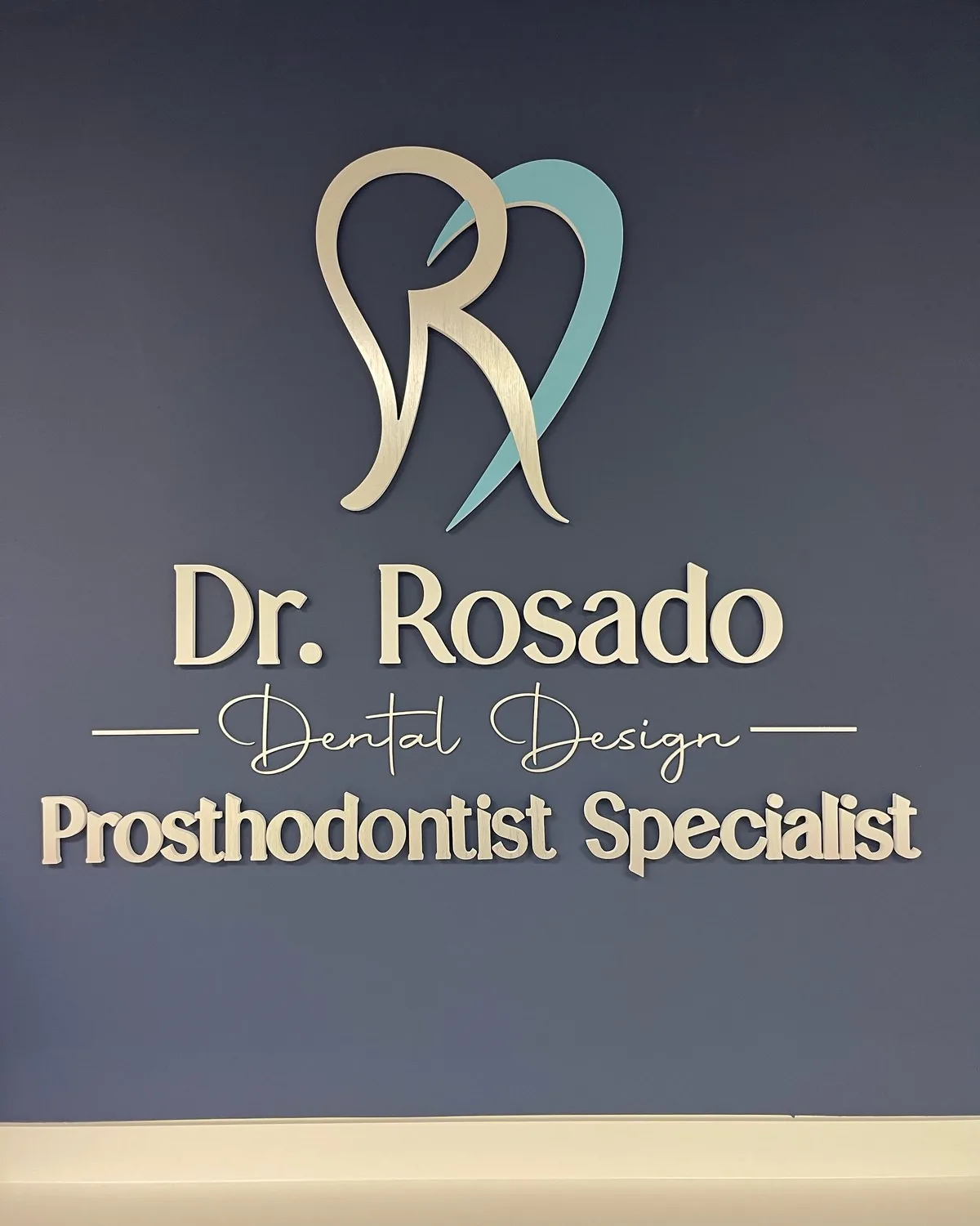 Dr. Rosado Dental Design wall sign, Prosthodontist Specialist, in the reception area